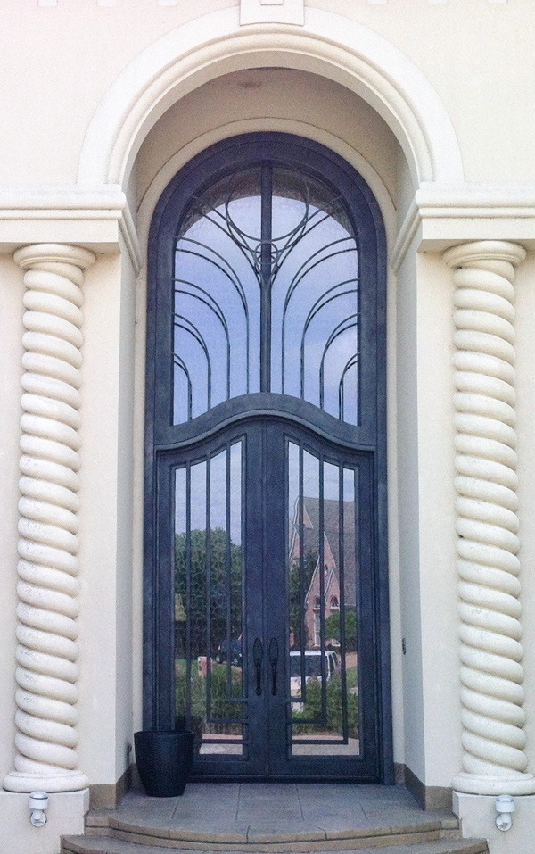 Beautiful double front doors with custom ripple shape top