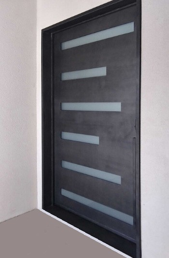 Large black finish iron door with small windows of various lengths